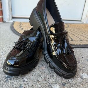 Shiny Black Loafers with Fringe Detail